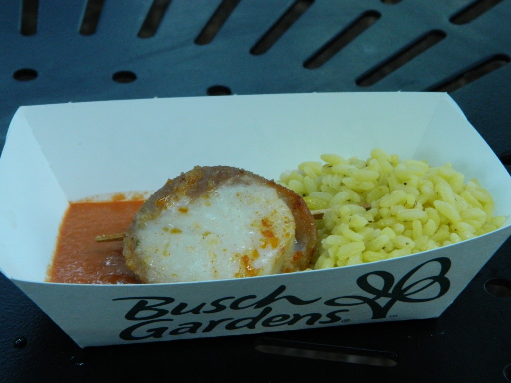 Spain: Venera con Jamón _ Scallop wrapped in cured ham with saffron rice and romesco sauce.